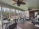 Comfortable screened porch with ceiling fans, casual seating and views of the backyard at 135 Ashley Hill Dr, Goose Creek, SC 29445