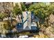Aerial view of a home highlighting the backyard patio with outdoor dining space and well-maintained landscaping at 14 Guerard Rd, Charleston, SC 29407