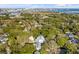 Expansive aerial view of a charming neighborhood with lush trees and waterways in the distance at 14 Guerard Rd, Charleston, SC 29407