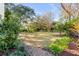 Spacious backyard featuring lush greenery, mature trees, and a well-manicured lawn, perfect for outdoor enjoyment at 14 Guerard Rd, Charleston, SC 29407