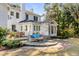 Charming outdoor space with a stone patio, comfortable seating, and a well-maintained deck for entertaining at 14 Guerard Rd, Charleston, SC 29407