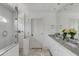 Bright bathroom featuring a glass-enclosed shower, dual sink vanity, and marble countertops at 14 Guerard Rd, Charleston, SC 29407