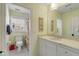 Bathroom featuring white marble counters, white cabinets, and a shower with floral curtains at 14 Guerard Rd, Charleston, SC 29407