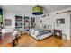 Bedroom featuring stylish bed, comfortable chair, and built-in shelving for display and storage at 14 Guerard Rd, Charleston, SC 29407