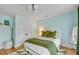 Cozy bedroom featuring green accents, a white comforter, and hardwood floors at 14 Guerard Rd, Charleston, SC 29407