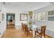 Bright dining room features a glass table with seating for six and lots of natural light at 14 Guerard Rd, Charleston, SC 29407