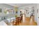 Bright dining area featuring a glass table, modern lighting, and seamless open to the kitchen and living areas at 14 Guerard Rd, Charleston, SC 29407