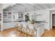 Well-appointed kitchen with white cabinetry, marble island with seating, and stainless steel appliances at 14 Guerard Rd, Charleston, SC 29407