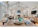 Spacious living room with high vaulted ceilings, fireplace, hardwood floors, and lots of natural light at 14 Guerard Rd, Charleston, SC 29407