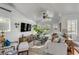 Spacious living room with vaulted ceilings, large windows, and stylish decor, perfect for relaxation and entertaining at 14 Guerard Rd, Charleston, SC 29407