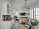 Open concept living space featuring a wet bar, living room and views into other rooms with nice light at 14 Guerard Rd, Charleston, SC 29407