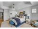 Elegant bedroom with a tray ceiling, shutters, a king bed and an ensuite at 14 Guerard Rd, Charleston, SC 29407