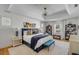 Spacious primary bedroom featuring a tray ceiling, large bed, and bench seating at 14 Guerard Rd, Charleston, SC 29407
