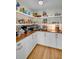 Organized pantry featuring white cabinetry, wood countertops, and open shelving fully stocked with food and small appliances at 14 Guerard Rd, Charleston, SC 29407