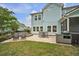 Spacious backyard with a patio, fire pit, and screened porch for outdoor enjoyment and entertaining at 149 Calm Water Way, Summerville, SC 29486