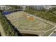 Aerial view of baseball fields with well-maintained infields and a neatly landscaped perimeter with surrounding trees at 149 Calm Water Way, Summerville, SC 29486