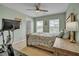 Comfortable bedroom with natural light, ceiling fan, and neutral color scheme at 149 Calm Water Way, Summerville, SC 29486