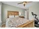 Comfortable bedroom with natural light, ceiling fan, and neutral color scheme at 149 Calm Water Way, Summerville, SC 29486