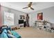 Spacious bedroom with neutral walls and carpet, fan, and large window at 149 Calm Water Way, Summerville, SC 29486