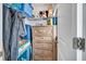 Storage closet that maximizes space, featuring built-in shelving, drawers, and wooden dresser at 149 Calm Water Way, Summerville, SC 29486
