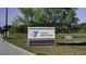 View of the YMCA Cane Bay Gathering Center sign, with lush greenery in the background at 149 Calm Water Way, Summerville, SC 29486