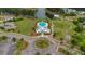 Aerial shot of a community pool and clubhouse surrounded by green spaces and walking paths at 149 Calm Water Way, Summerville, SC 29486