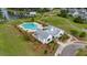 Aerial view of the community pool, clubhouse and walking path near a lake for a picturesque neighborhood setting at 149 Calm Water Way, Summerville, SC 29486