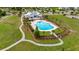 Aerial view of the refreshing community pool and clubhouse with lounging and landscaped grounds in neighborhood at 149 Calm Water Way, Summerville, SC 29486