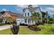 Charming two-story home features light blue siding, front porch, attached garage, and professionally landscaped front yard at 149 Calm Water Way, Summerville, SC 29486