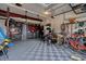 Organized garage with storage solutions and space for multiple vehicles and hobbies at 149 Calm Water Way, Summerville, SC 29486