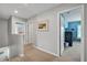 Well-lit hallway with carpet and access to other rooms in the house at 149 Calm Water Way, Summerville, SC 29486