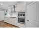 Modern kitchen featuring white cabinets, stainless steel appliances, and granite countertops at 149 Calm Water Way, Summerville, SC 29486