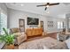 Spacious living room with two comfortable armchairs, large TV, and bright, neutral decor at 149 Calm Water Way, Summerville, SC 29486