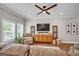Bright living room with cozy seating, a large TV, and stylish decor at 149 Calm Water Way, Summerville, SC 29486