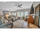 Open-concept living room features hardwood floors, neutral paint, recessed lighting, and plantation shutters at 149 Calm Water Way, Summerville, SC 29486