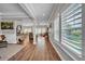 Bright and airy living room boasts hardwood floors, neutral walls, and plantation shutters at 149 Calm Water Way, Summerville, SC 29486