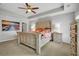 Serene main bedroom featuring a tray ceiling, ceiling fan, and coordinating furniture at 149 Calm Water Way, Summerville, SC 29486