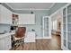 Bright and airy office with hardwood floors, built-in cabinets, and a view of the front yard at 149 Calm Water Way, Summerville, SC 29486