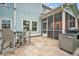 Outdoor patio with tile flooring, dining set, and a grill, ideal for entertaining guests at 149 Calm Water Way, Summerville, SC 29486