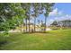 Scenic view of a pond surrounded by lush greenery and well-maintained lawns at 149 Calm Water Way, Summerville, SC 29486