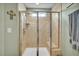 Bright bathroom shower with tiled surround and a clear glass door enclosure at 149 Calm Water Way, Summerville, SC 29486