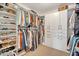 Spacious walk-in closet featuring custom shelving and ample storage for clothes and shoes at 149 Calm Water Way, Summerville, SC 29486