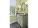 Bathroom featuring a vanity with a stone countertop, a framed window, and ample lighting at 17 Trumbo St, Charleston, SC 29401