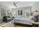 Bright bedroom with a seating area, featuring hardwood floors and plenty of natural light at 17 Trumbo St, Charleston, SC 29401