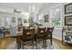 Dining area with hardwood floors, chandelier, and seamless flow into the adjacent living spaces at 17 Trumbo St, Charleston, SC 29401