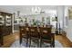 Open dining space featuring hardwood floors, stylish furniture, and a view into the kitchen at 17 Trumbo St, Charleston, SC 29401