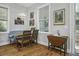 Charming dining area with bench seating, wood table, and unique light fixture at 17 Trumbo St, Charleston, SC 29401