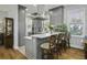 Modern kitchen with gray cabinets, a breakfast bar, and stainless steel appliances at 17 Trumbo St, Charleston, SC 29401
