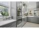 Modern kitchen featuring double ovens, stainless steel appliances, and white countertops at 17 Trumbo St, Charleston, SC 29401
