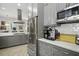 Open kitchen layout with stainless steel appliances, marble countertops, and modern cabinetry at 17 Trumbo St, Charleston, SC 29401